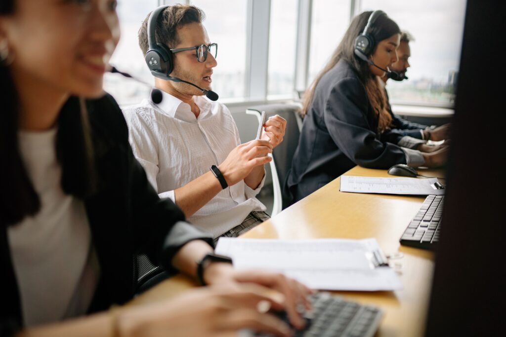 pexels photo 8867261 8867261 A diverse team of call center agents working together in a modern office setting.